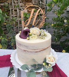 a wedding cake with flowers on the table