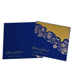 two blue and gold wedding cards with floral designs on the front, one is folded