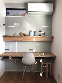 a room with a desk, chair and air conditioner on the wall next to it