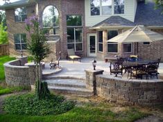 an outdoor patio with seating and umbrellas