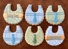 baby bib cookies decorated to look like they are ready for the first birthday boy