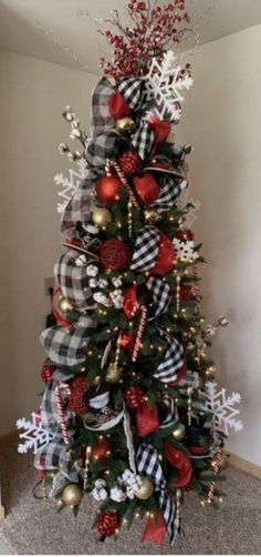 a christmas tree decorated with red, white and black ornaments