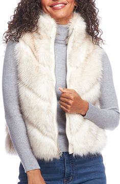 Soft and fluffy faux fur lends cozy comfort to a reversible vest equipped with handy pockets. Stand collar Lined 70% modacrylic, 30% acrylic faux fur with 100% polyester reverse Machine wash, line dry Imported Mink Vest, Cozy Wrap, Fabulous Furs, Reversible Vest, Chevron Quilt, Outerwear Vest, Fur Vest, Hooded Coat, Comforters Cozy