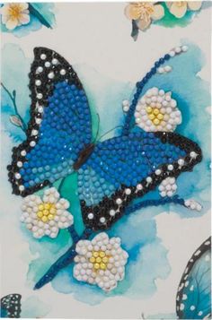 a blue butterfly with white and yellow flowers on it's wings is featured in this painting