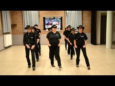 a group of police officers walking down a hall