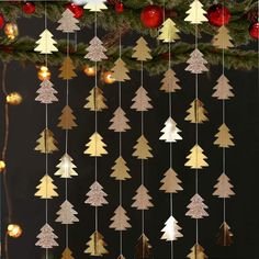 a christmas tree mobile hanging from the ceiling