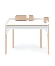 a white table with two wooden blocks on it's top and one block at the bottom