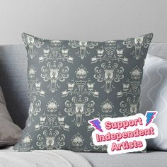 a pillow with the words support independent artists on it