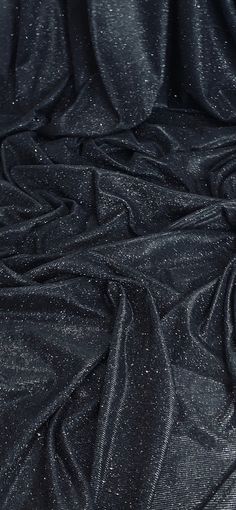 black fabric with silver glitters on it