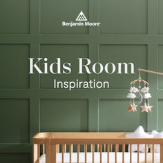 a baby crib in front of a green wall with the words kids room inspiration written on it