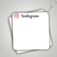 an instagram keychain with the word instagram on it and two sheets of paper