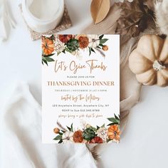 a thanksgiving dinner party is set up on a table