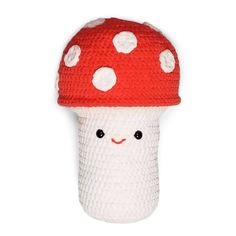 a knitted mushroom with white polka dots on it's head is shown in front of a white background