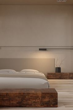 a large bed sitting in the middle of a bedroom next to a wall mounted air conditioner