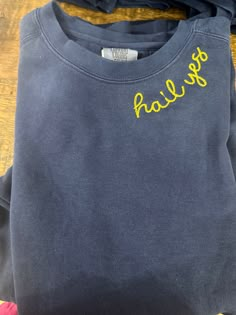 Hand embroidered Comfort Colors Vintage navy sweatshirt. Oversized and a perfect graduation gift or tailgate fit. Embroidery College Sweatshirt, Hand Embroidered College Sweatshirt, Embroidered Crew Neck Sweatshirt For College, Embroidered Cotton Sweatshirt For College, College Sweatshirt With Embroidered Text And Relaxed Fit, Embroidered Sweatshirt Ideas, Sweatshirt Embroidery, Football Embroidered Sweatshirt, Crewneck Embroidery