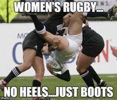 two women are playing rugby on the field