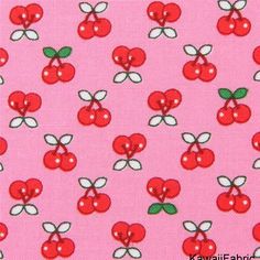 a pink background with red cherries on it