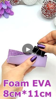 a woman is holding a purple box with glitter on it and the words foam eva 8cm