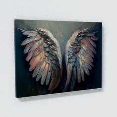 an abstract painting of two wings on a white wall