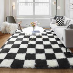 a black and white checkered rug in a living room