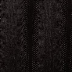 black textured fabric with vertical lines on the bottom and diagonal stripes at the top