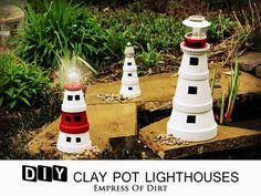 three little lighthouses are sitting on the ground