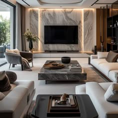 a modern living room with marble walls and furniture