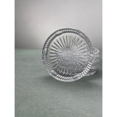 a clear glass dish on a table