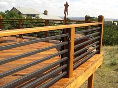 a person standing on top of a wooden deck