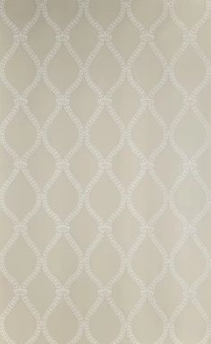 a white wallpaper with an intricate design on it