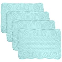 three aqua blue placemats with wavy design on the front and back, set of four