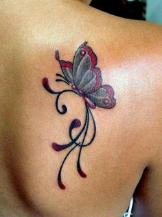 a woman with a butterfly tattoo on her back