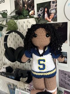 a crocheted stuffed animal with a jersey on