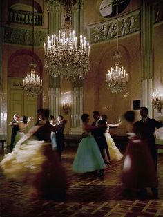 a group of people dancing in a ballroom