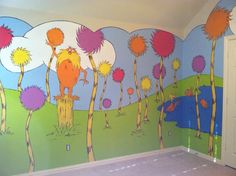 the dr seuss wall mural is painted in an empty room