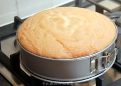 a round cake sitting on top of a stove