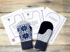 two mittens sitting next to each other on top of a piece of paper with sewing instructions