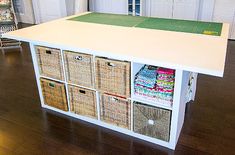 a kitchen island with baskets on the top