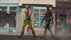 two deadpools are walking down the street