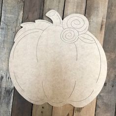 a paper cut out of a pumpkin with the number eight on it's side