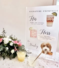 a table with flowers and a sign that says, signature cocktails for floss