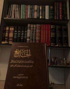 a bookcase filled with lots of books next to a shelf full of other books