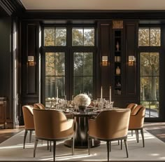 an elegant dining room with large windows and glass doors leading to the outside patio area