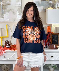 Introducing our "Game Day With Football Bow Graphic Shirt," a stylish and spirited addition to your game day wardrobe. Available in sizes S through 5XL, this shirt features a fun design with a football bow, perfect for showing off your love for the game. Whether it's game day, tailgating, or Friday night lights, this shirt captures the excitement of football season.
Crafted from high-quality, soft materials, this shirt ensures all-day comfort, making it ideal for cheering from the stands, enjoying a tailgate party, or watching the game with friends. The "Game Day With Football Bow Graphic Shirt" is designed to celebrate the fun and energy of football season.
Show your team spirit with this versatile and comfortable graphic shirt. Whether you're supporting your favorite team, gearing up for Oc Wings, Pre-shrunk Fan Apparel T-shirt For Game Day, White Sporty Sublimation T-shirt For Game Day, Game Day Pre-shrunk Short Sleeve T-shirt, Graphic Tee T-shirt For Game Day With Text Print, Tiger Shirts, Short Sleeve Sublimation T-shirt For Football Season Game Day, Womens Football Shirts, Team Spirit Shirts