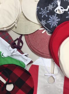 many hats are laid out together on the floor and ready to be sewn in