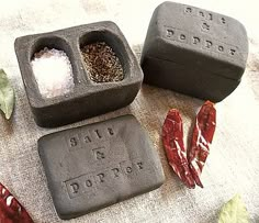 two soaps with salt and pepper in them