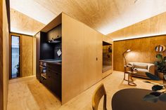 a room with wood paneling and wooden furniture