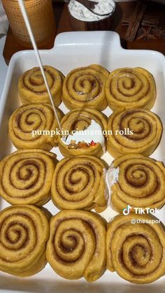 there are many cinnamon rolls in the pan