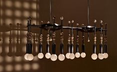 a chandelier with eight lights hanging from it's sides in a room