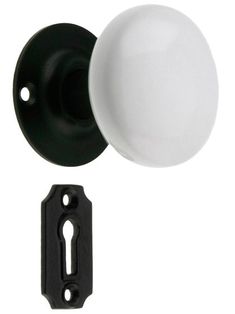 an image of a white door knob and black handle